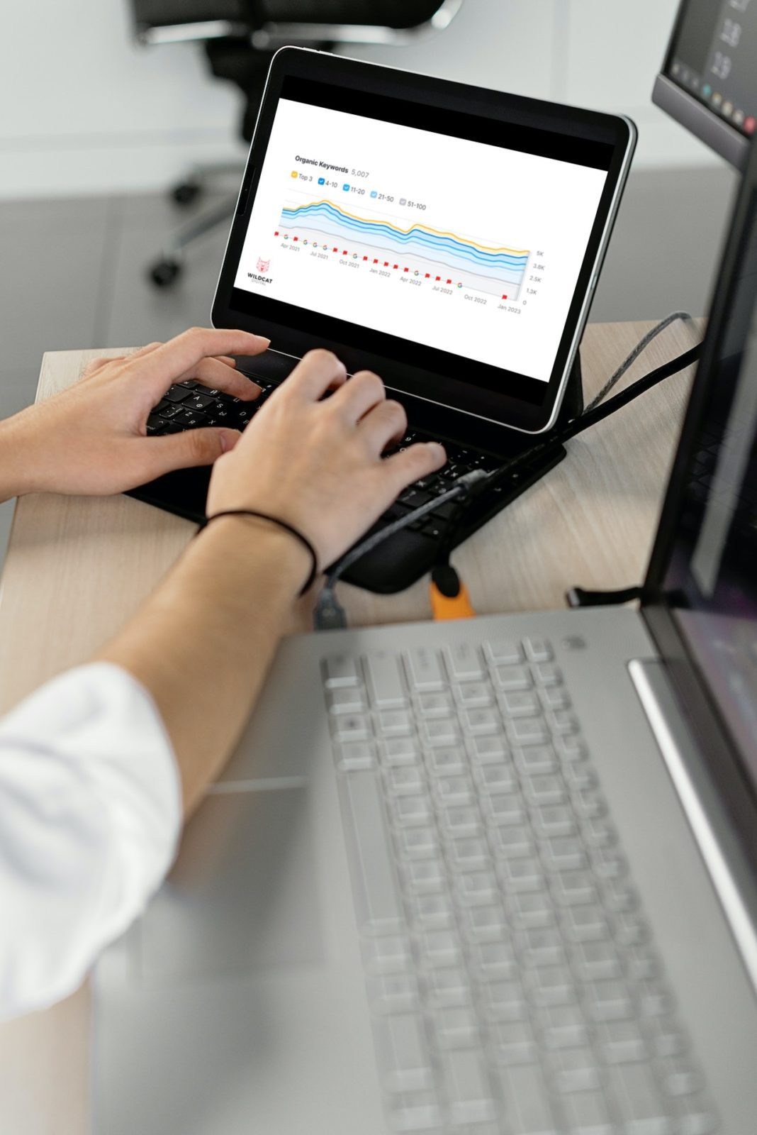 Person using a tablet that shows campaign stats