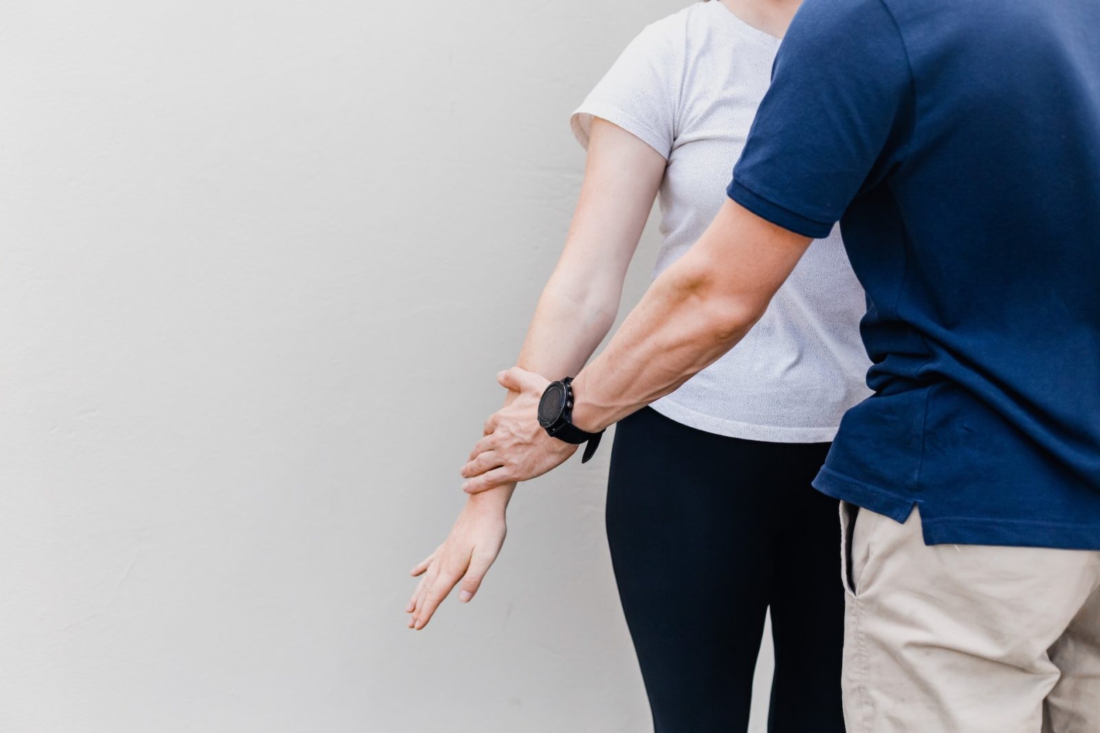 Physiotherapist working on a woman's arm Physiotherapist working on a woman's arm