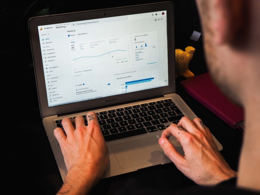 Man on laptop showing Google Analytics