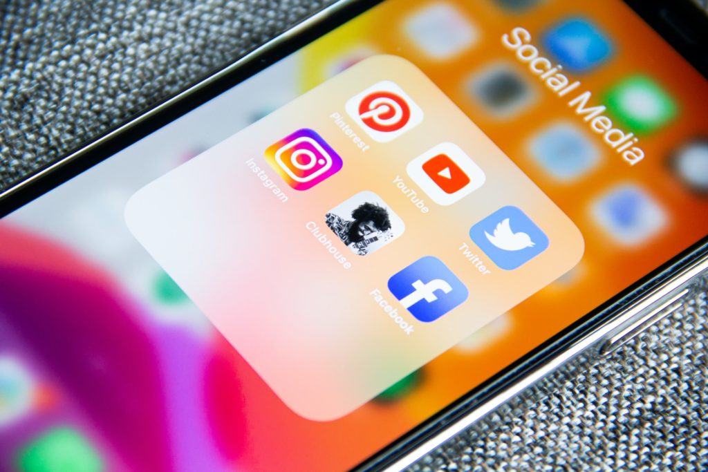 Mobile phone showing social media app icons