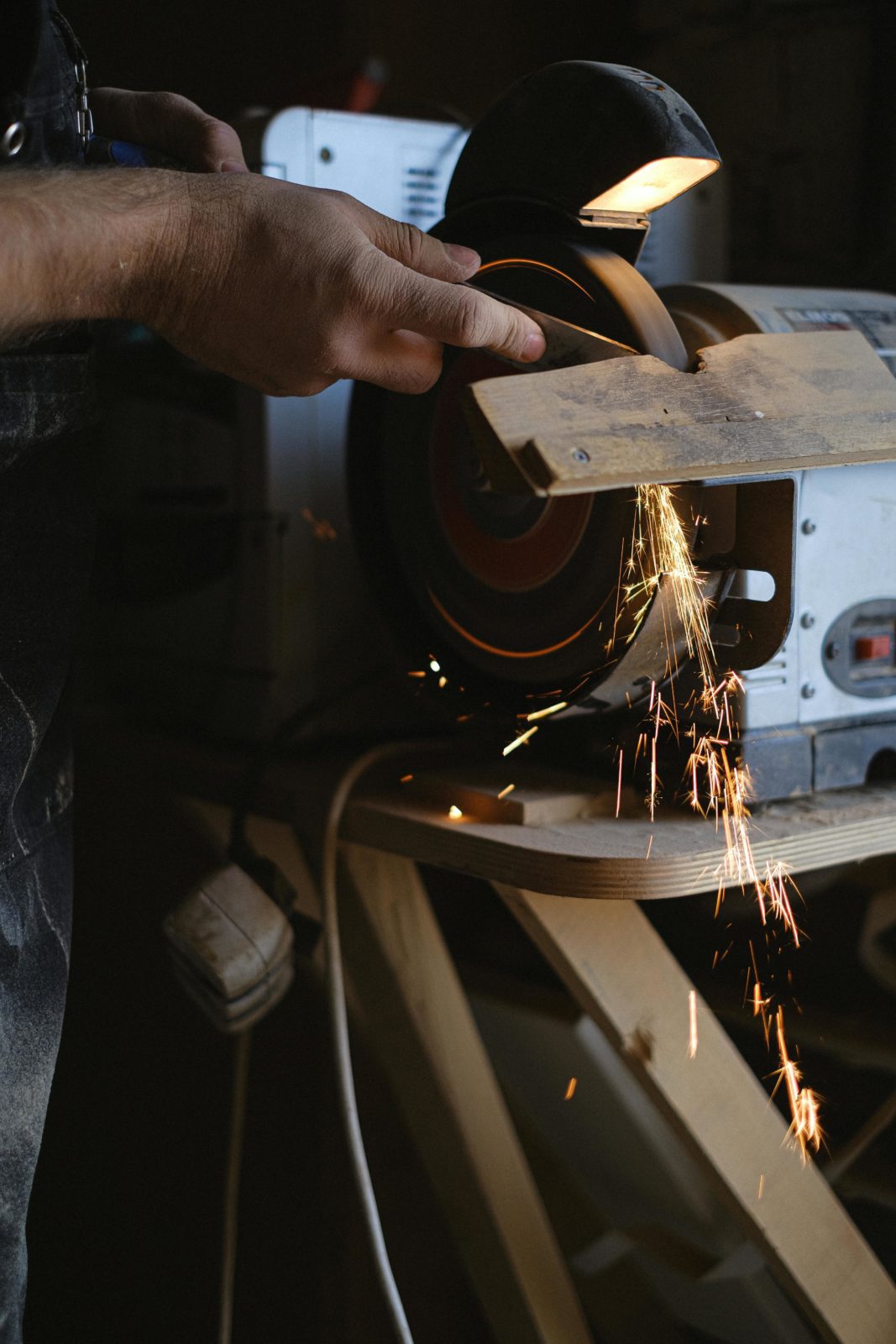 sawing through wood with machine