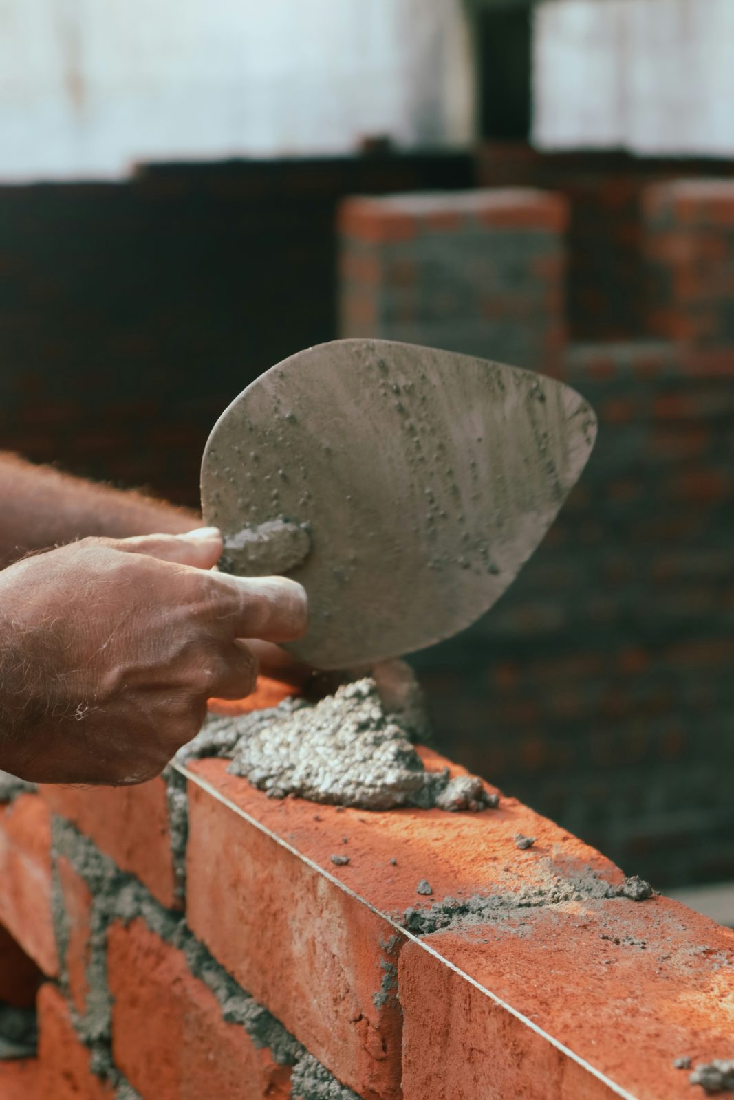Man laying bricks
