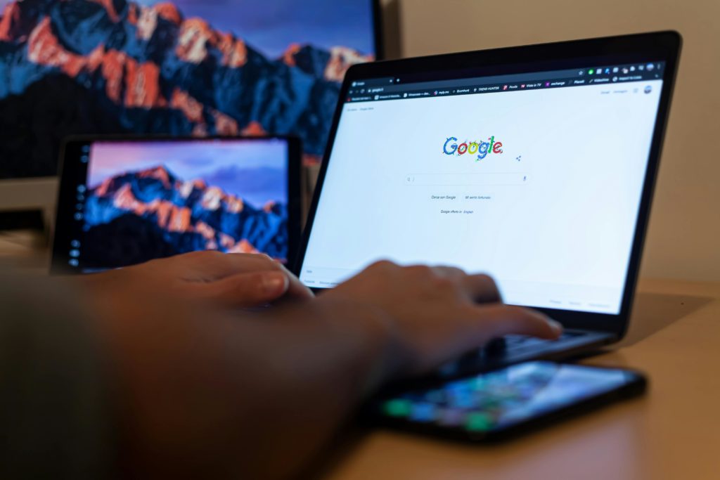 Man searching on google on laptop